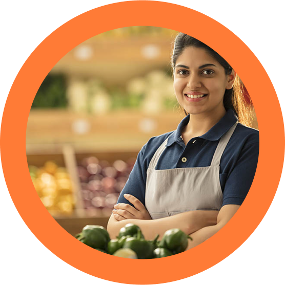 Beautiful girl with a smiling face in her grocery shop.